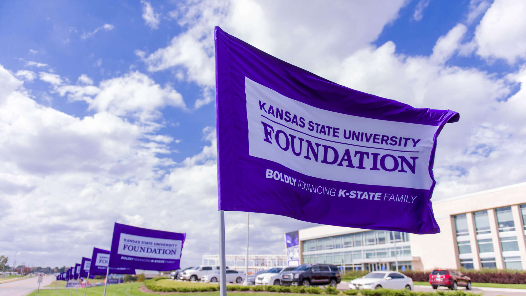 purple flags in front of KSU Foundation building