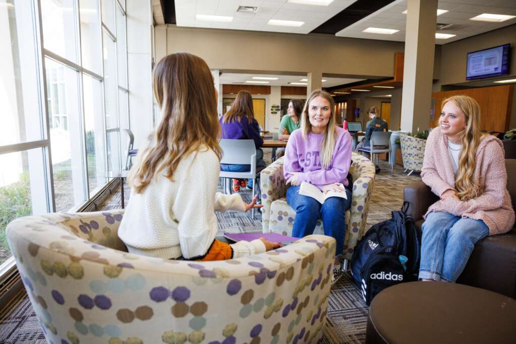 students talking in college of health and human science 