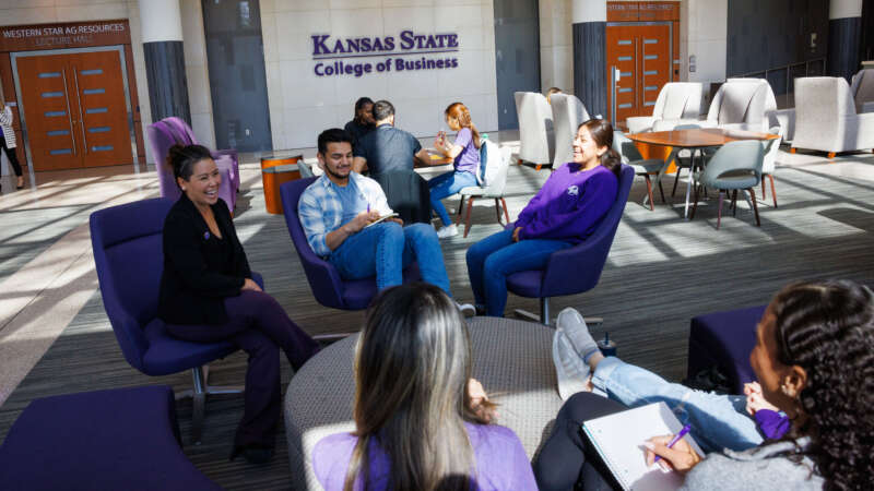 students sitting in atrium