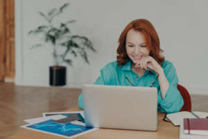 women sitting at computer