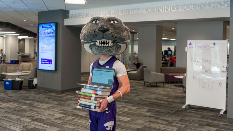 willie with textbooks and laptop