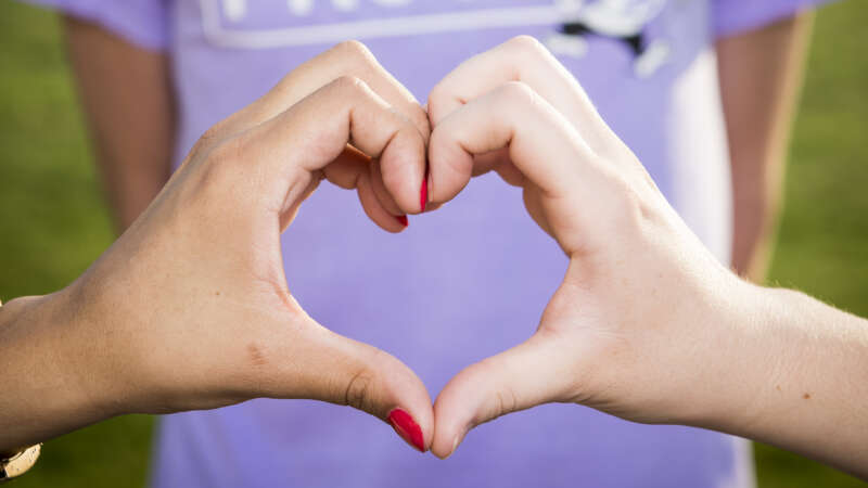 k-state proud t-shirt with hands making a heart shape