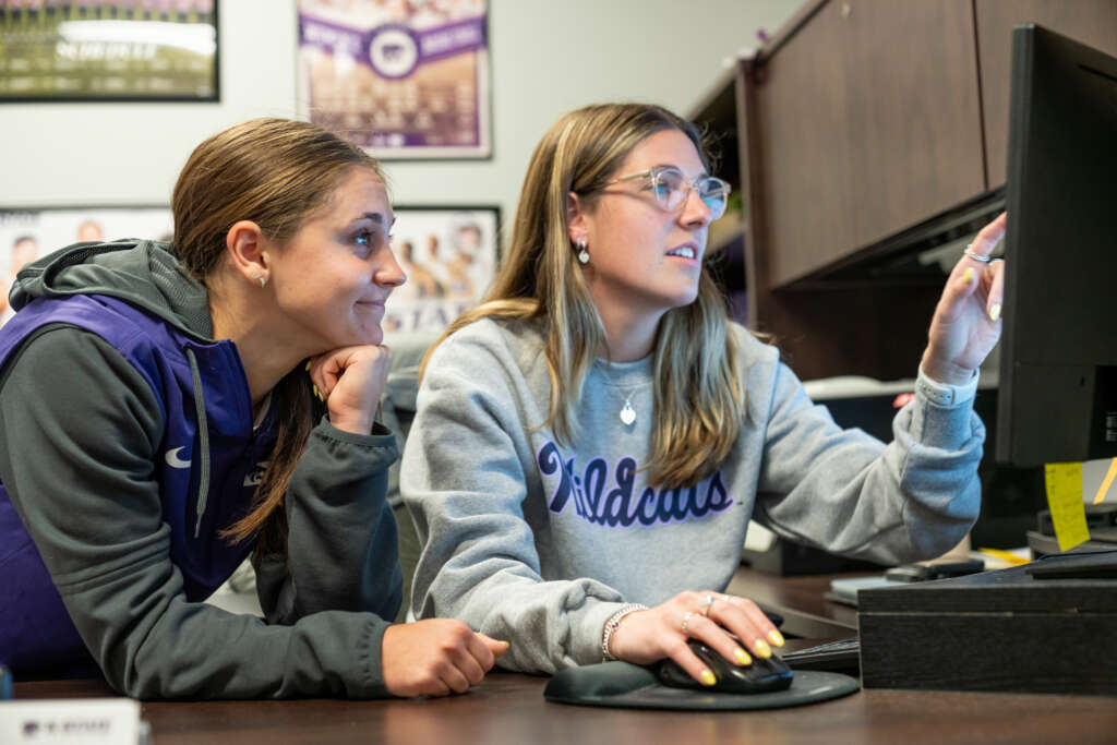 student and academic advisor meet