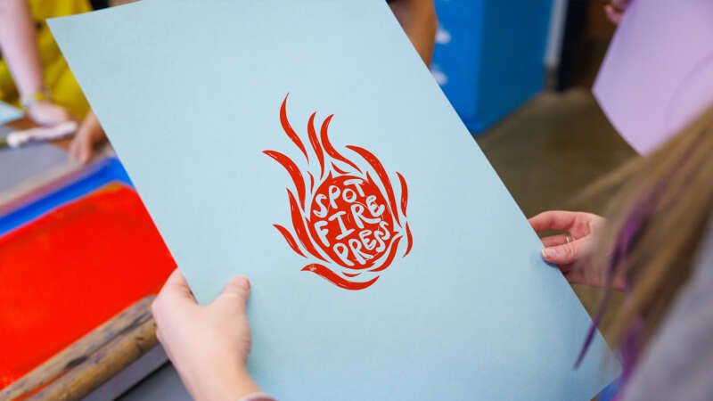 linoleum block print reading "spotfire press"