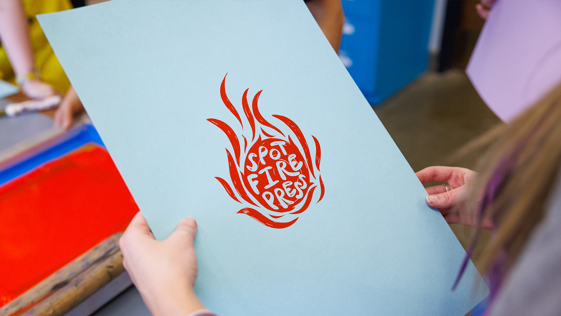 linoleum block print reading "spotfire press"