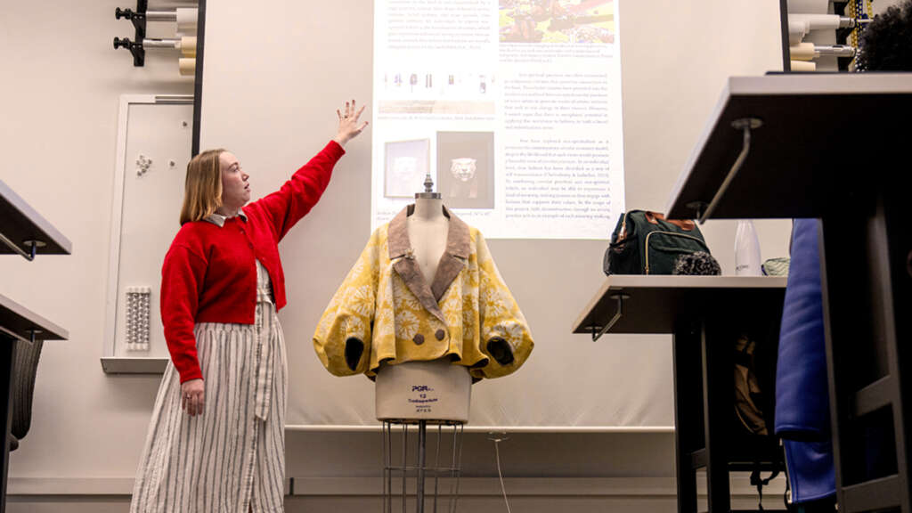 student presenting at a sustainable fashion and color class