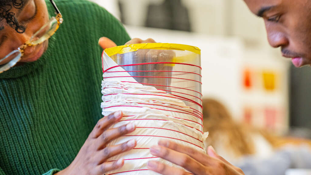 students soaking their garment in dye